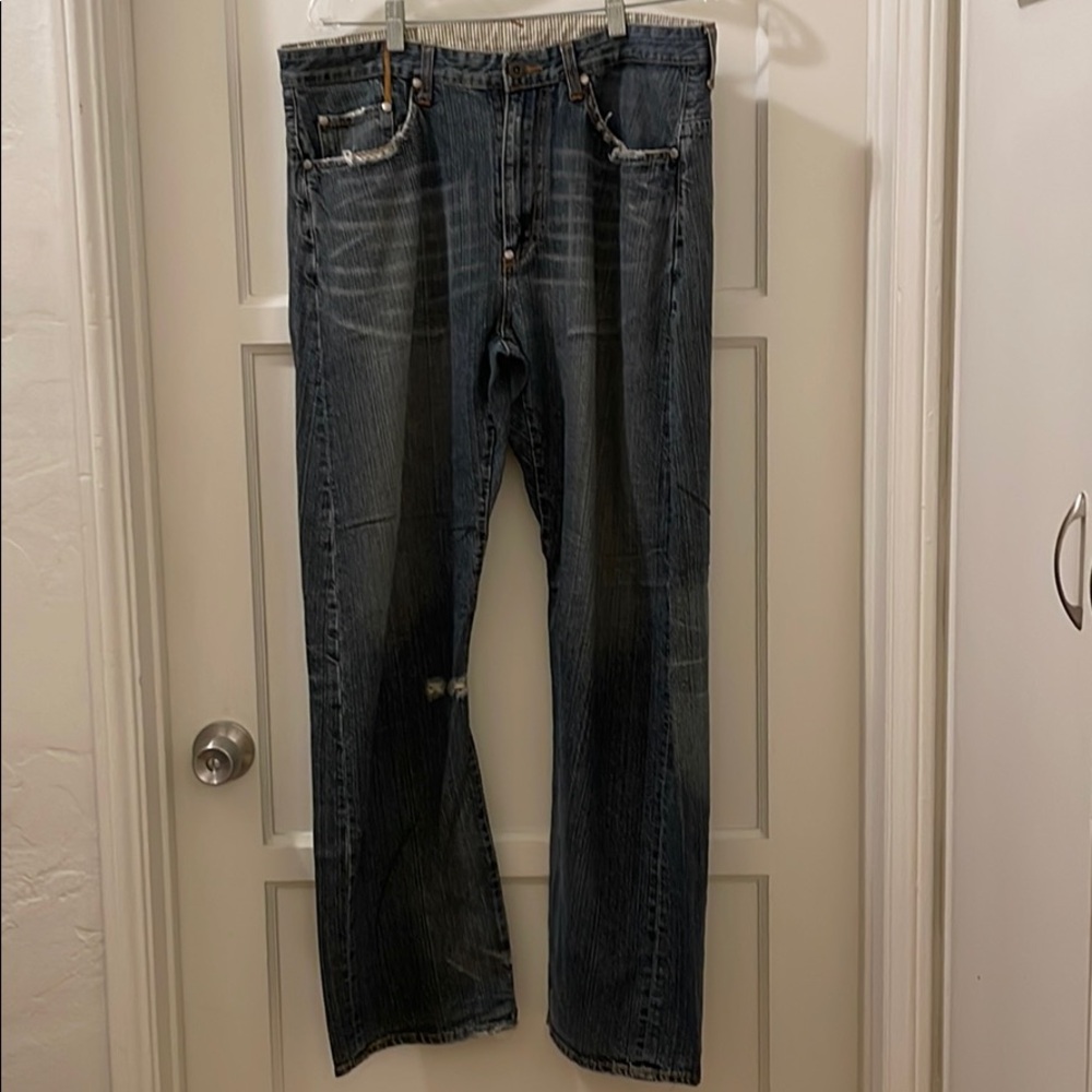 Distressed blue jean